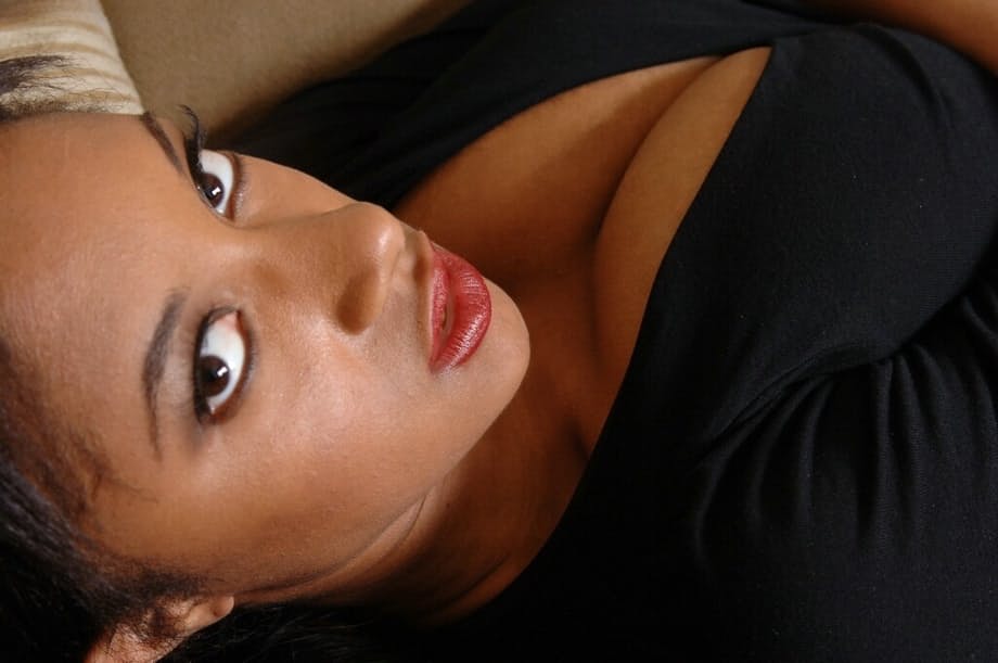 Saucy ebony amateur with huge melons undressing and teasing her honey pot