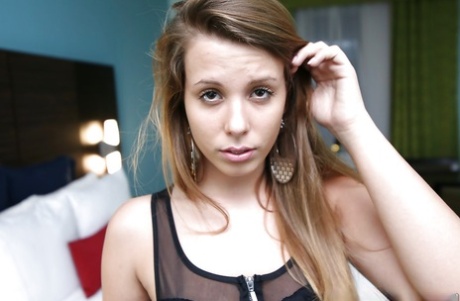 Tempting amateur cutie revealing her ample tits and shaved honey pot