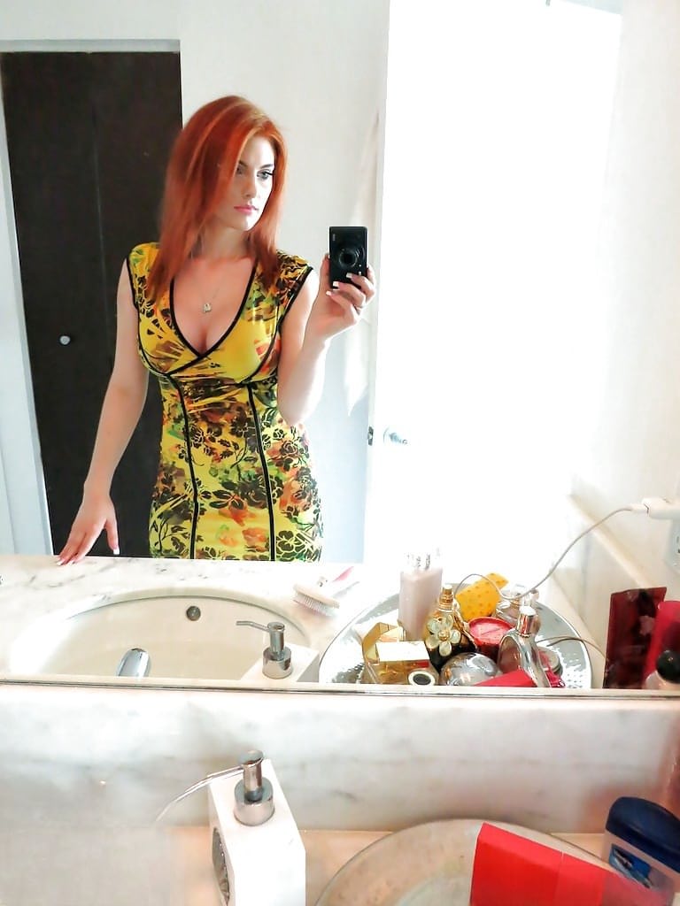 Amateur redhead girl Rainia Belle makes sexy, amusing self shots