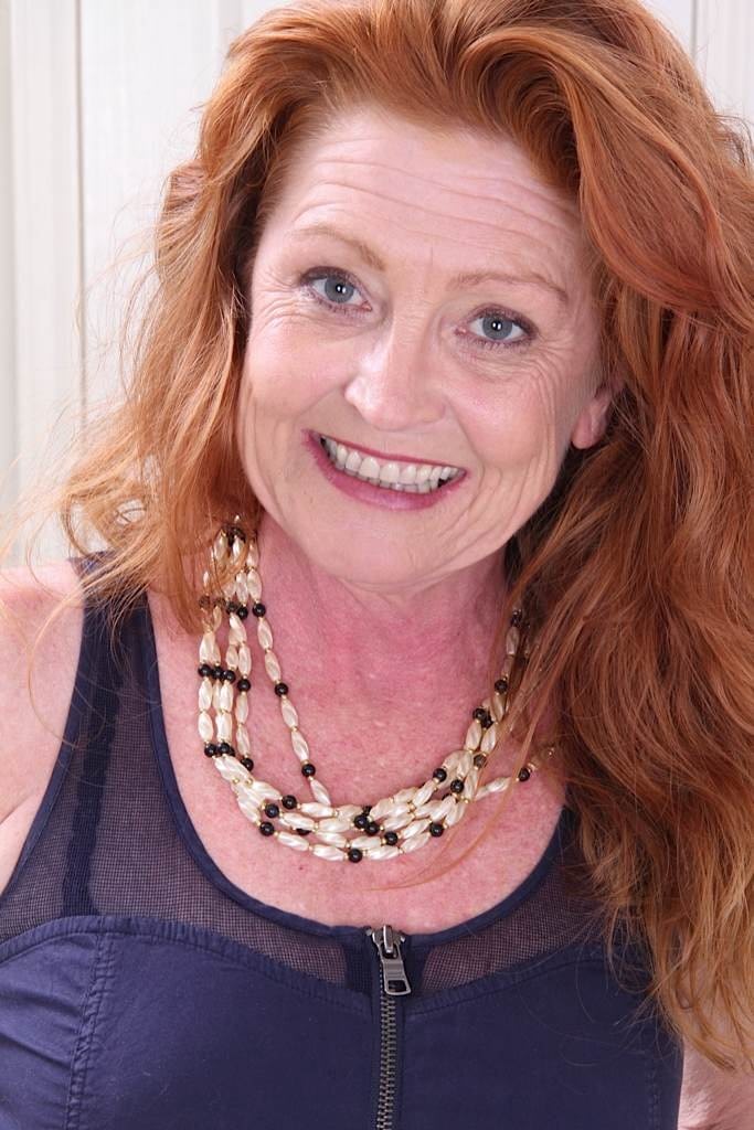 Awesome mature redhead in stockings Veronica showing her ass