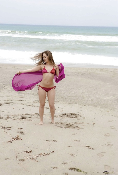 Amazing wet babe Remi showing that beautiful body on the beach