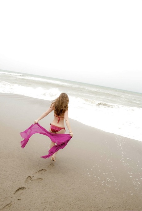 Amazing wet babe Remi showing that beautiful body on the beach