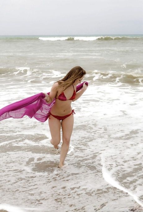 Amazing wet babe Remi showing that beautiful body on the beach