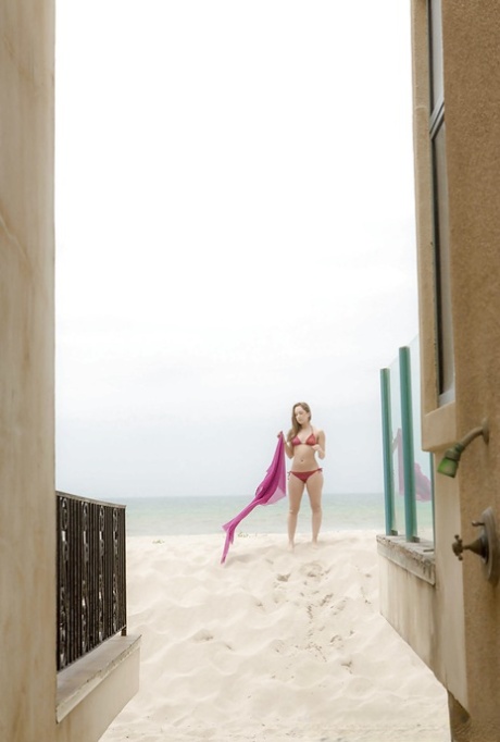 Amazing wet babe Remi showing that beautiful body on the beach