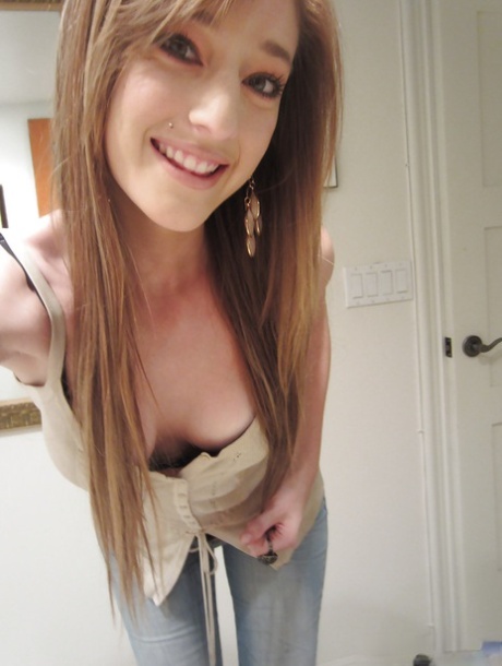 Tiny tit brunette Casana undressing in the bathroom to show herself