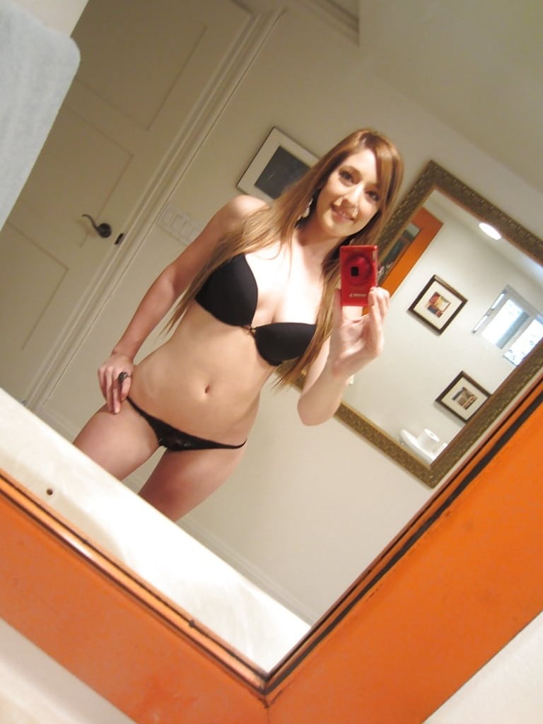 Tiny tit brunette Casana undressing in the bathroom to show herself