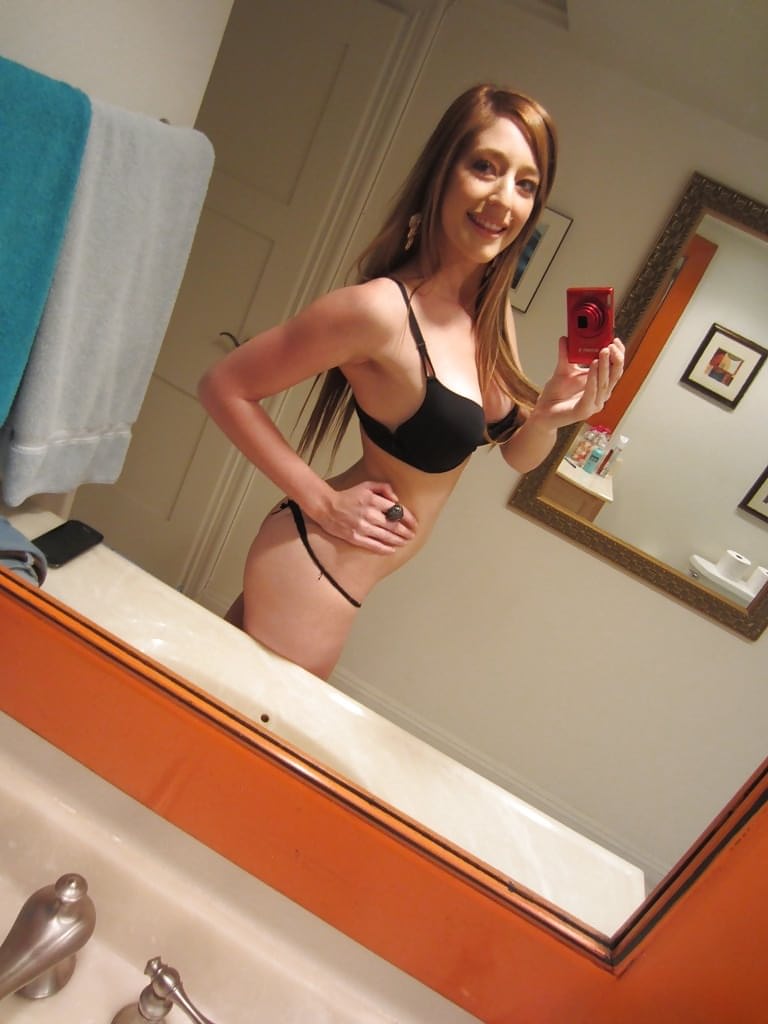 Tiny tit brunette Casana undressing in the bathroom to show herself