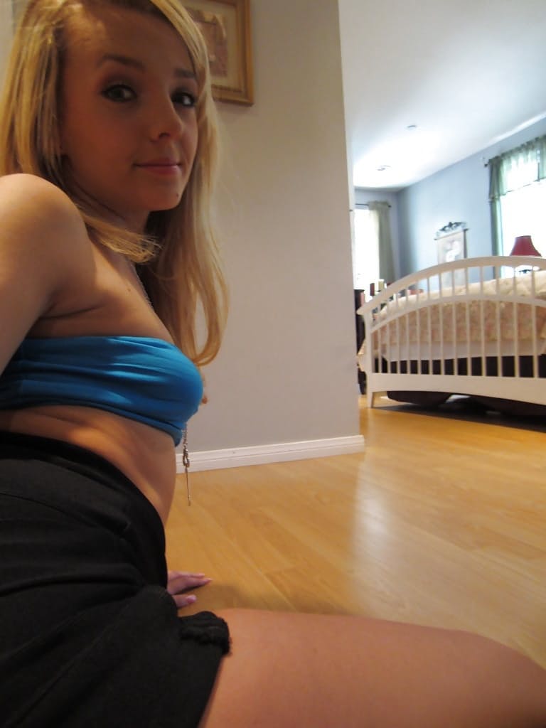 Ally Winters is spreading her slim legs wide open while masturbating