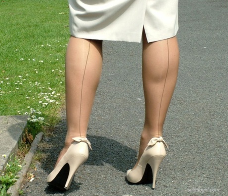 Outdoor posing from a beautiful non nude model in high heels Donna