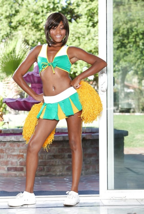 Black cheerleader Karma May shows off her big dark ass and tits