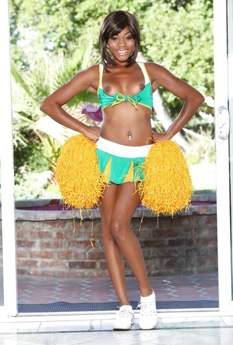 Black cheerleader Karma May shows off her big dark ass and tits