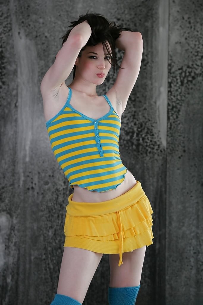 Slender teen babe Stoya poses in sexy outfit and finally gets naked