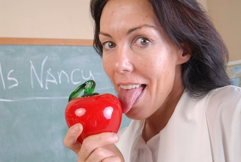 Naughty granny Nancy gets completely naked in the school room
