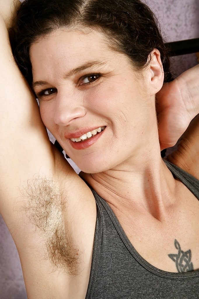 Older woman Sunshine spreading her hairy vagina wide open