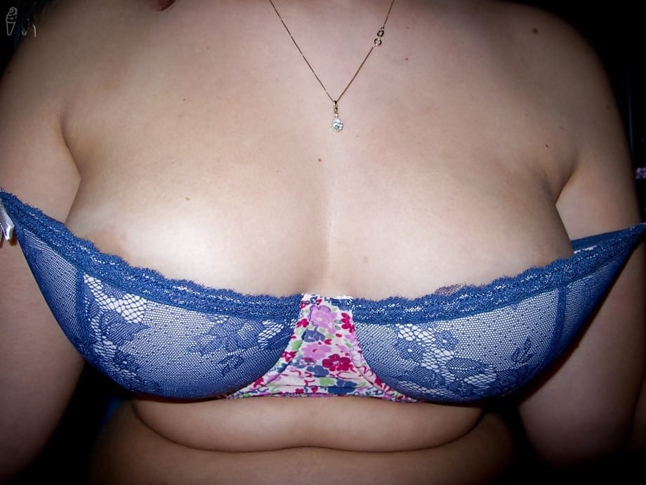Young fatty Ariel D poses in glasses while flashing large natural tits