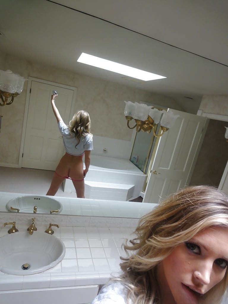 Young blonde Samantha Saint taking nude selfies in the bathroom