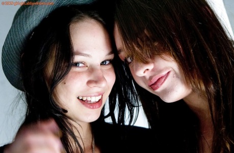 Teen girls Carly T and Rebekah strip off ripped denim jeans to model nude