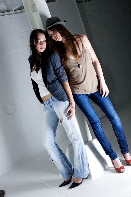 Teen girls Carly T and Rebekah strip off ripped denim jeans to model nude