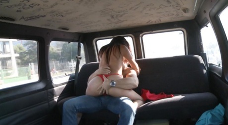Busty babe gets fucked in backseat of car and has face covered in cum