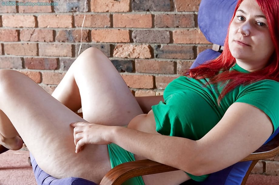 Chubby redhead teen Adalin shows off her puffy hairy pussy and fat butt