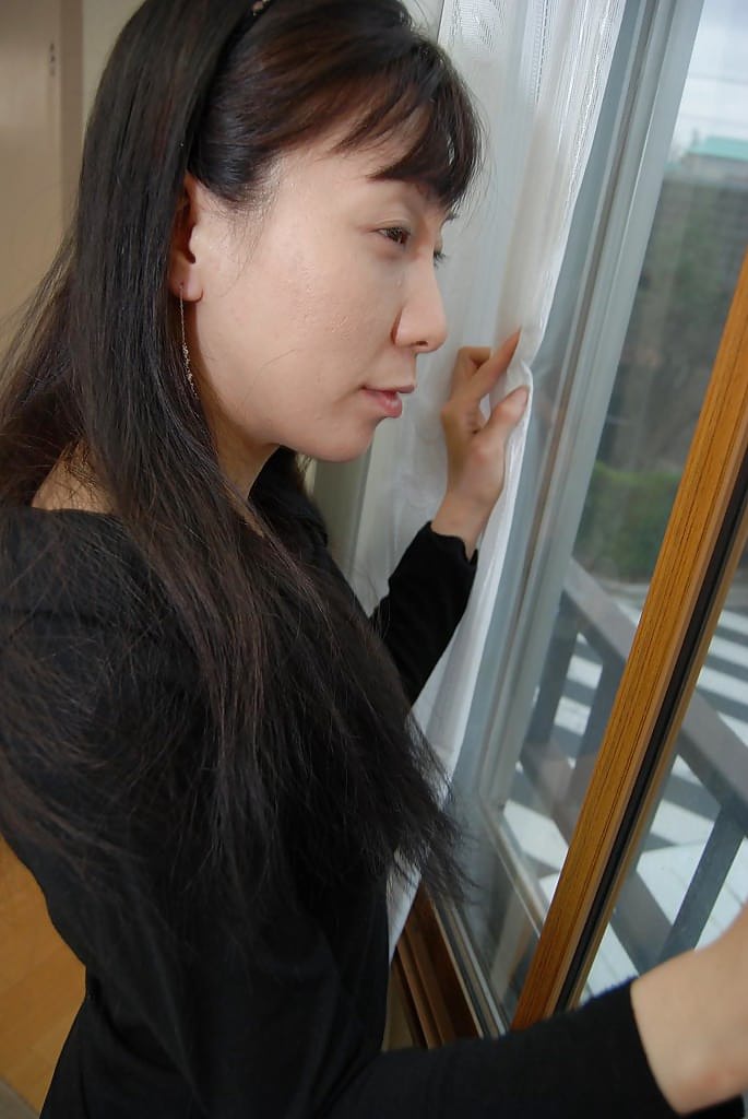 Japanese wife Kanae Otani fingering hairy Asian pussy after stripping