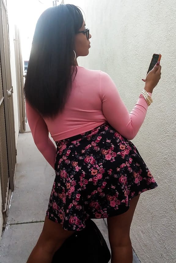 Busty black girl Porsha Carrera bends over in high heels for upskirt