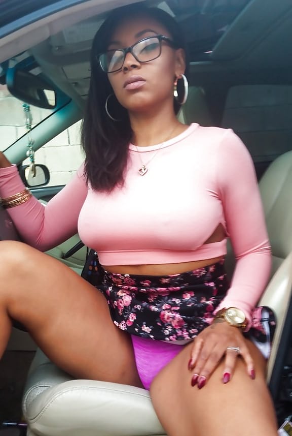 Busty black girl Porsha Carrera bends over in high heels for upskirt