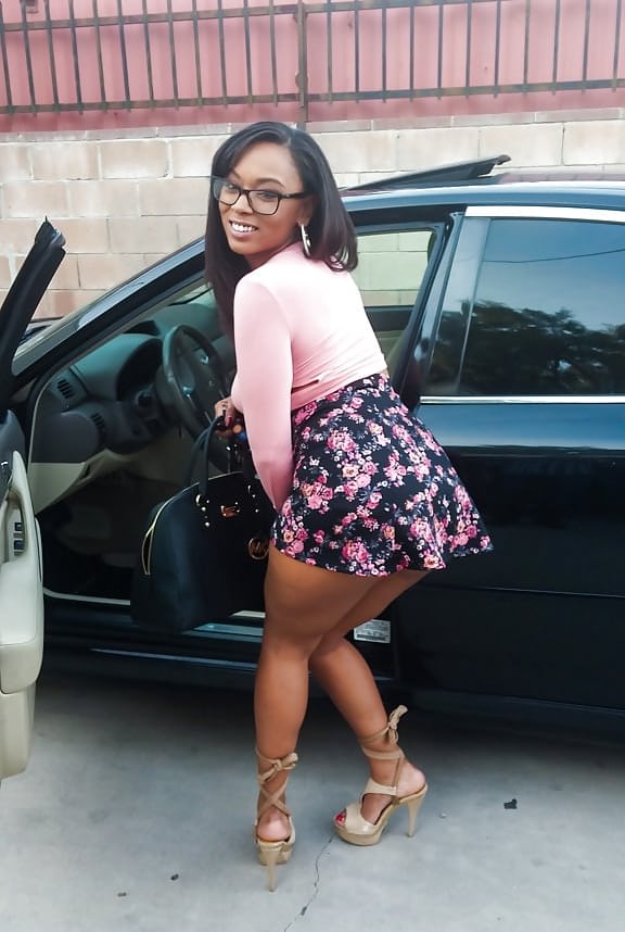 Busty black girl Porsha Carrera bends over in high heels for upskirt