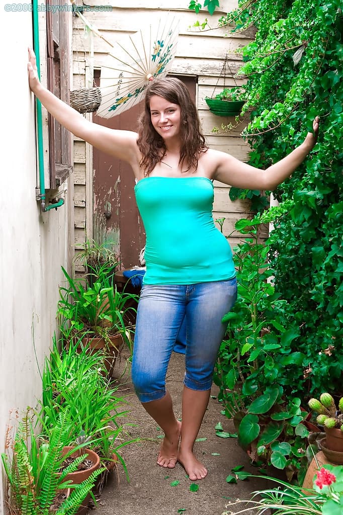 Pretty amateur Megan flashes big natural tits outdoors while fingering cunt