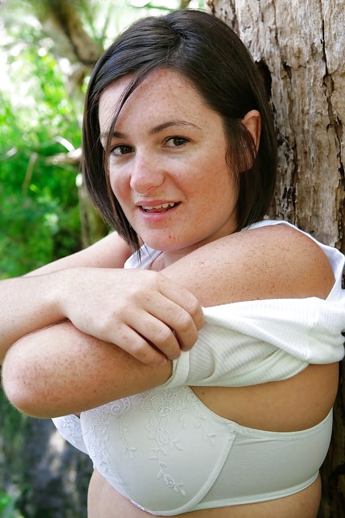 Chubby girl with freckles and big natural boobs spreads hairy cunt outside