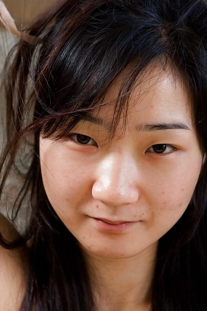 Cute small tit Asian amateur Oksana spreading her hairy twat