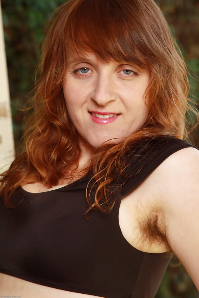 Ugly redhead woman Velma exposing her hirsute body outdoors