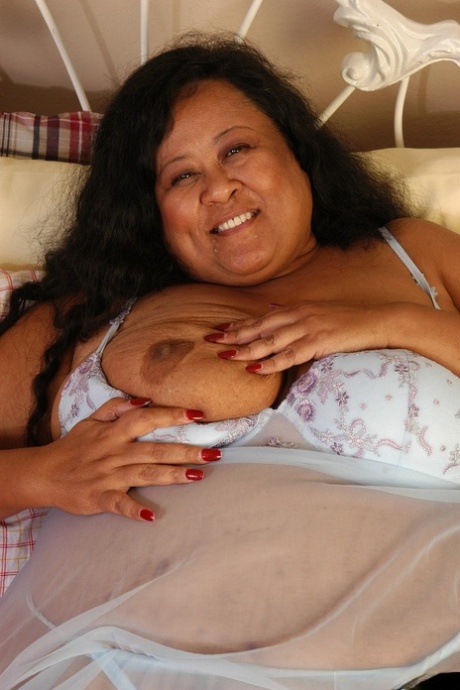 SSBBW Debrina lets fat tits loose from lingerie for nipple licking
