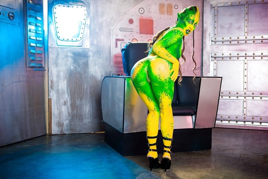 Kinky cosplay chick Tiffany Doll posing in body paint uniform and spreading