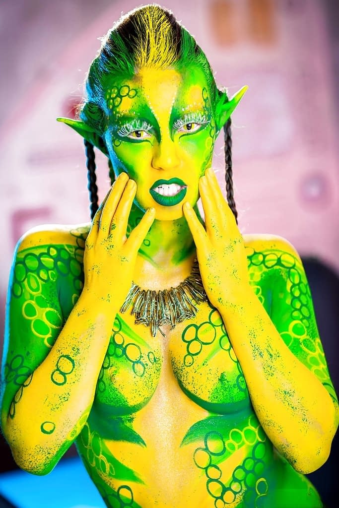 Kinky cosplay chick Tiffany Doll posing in body paint uniform and spreading