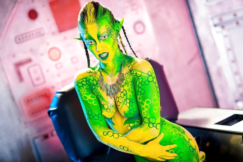 Kinky cosplay chick Tiffany Doll posing in body paint uniform and spreading