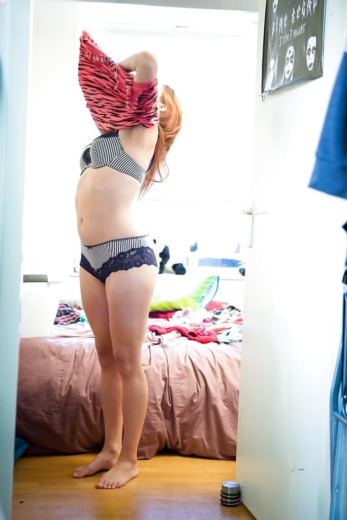 Bushy amateur Lynn caught on hidden camera getting dressed after nude poses