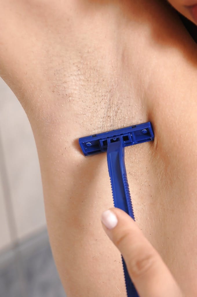 Gorgeous brunette slut Blue Angel shaving her armpits in the bathroom