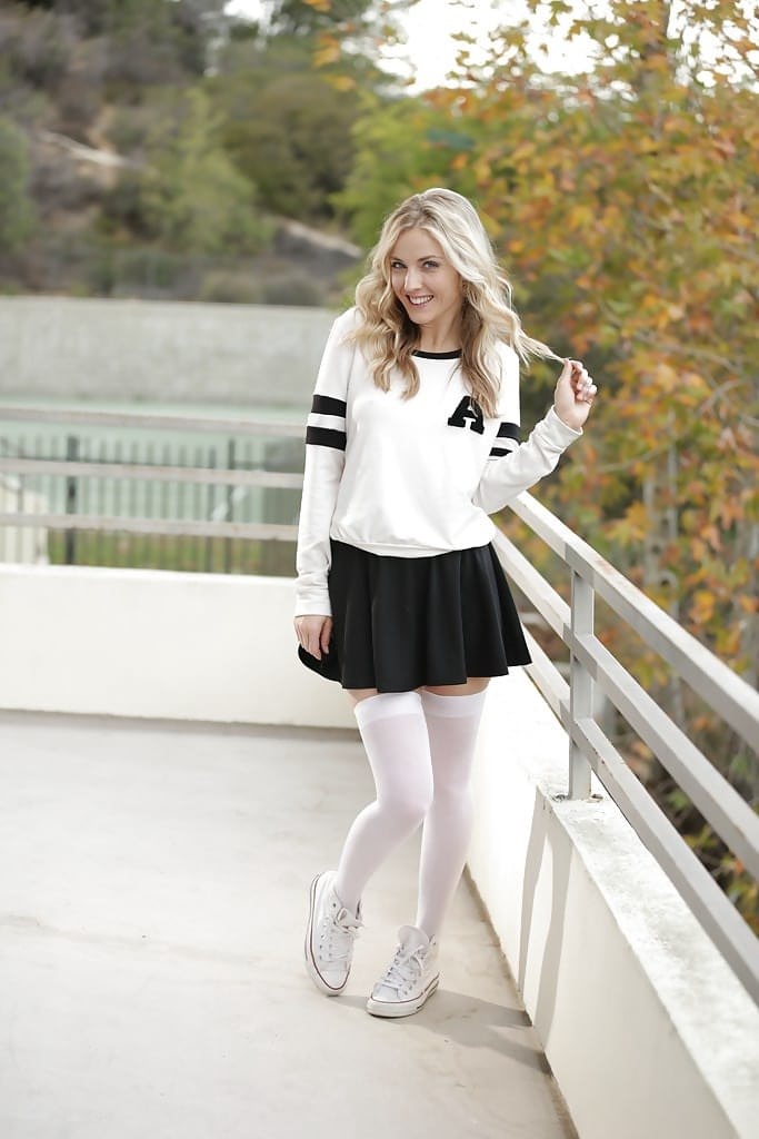 Blonde pornstar Karla Kush posing topless outdoors in schoolgirl uniform