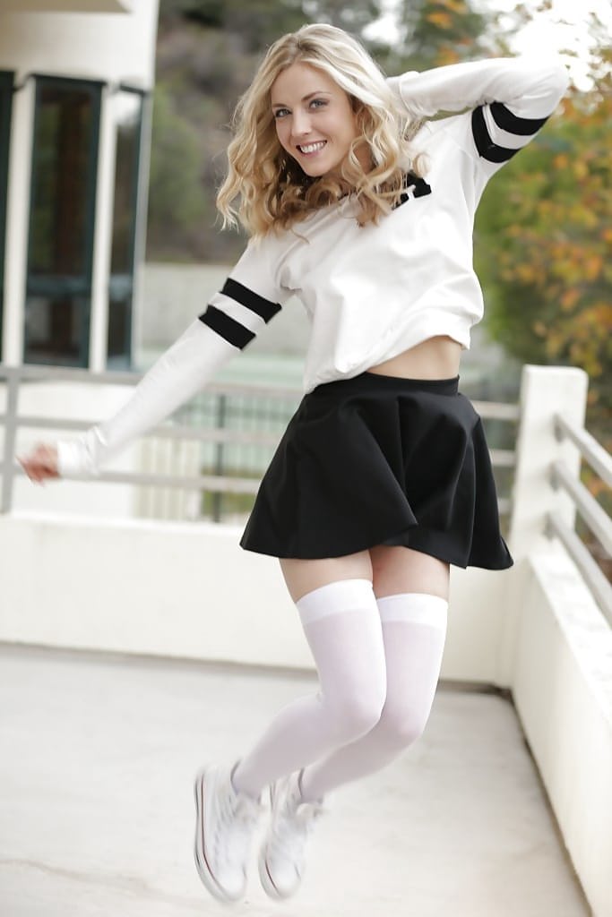 Blonde pornstar Karla Kush posing topless outdoors in schoolgirl uniform