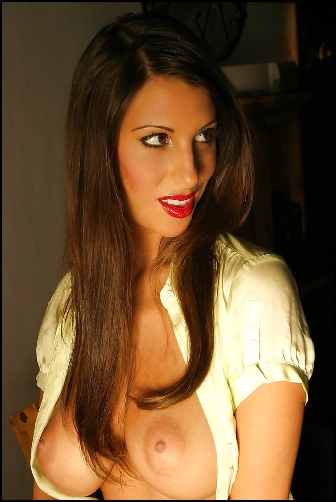 Busty babe unbuttons her satin blouse and shows fine boobs