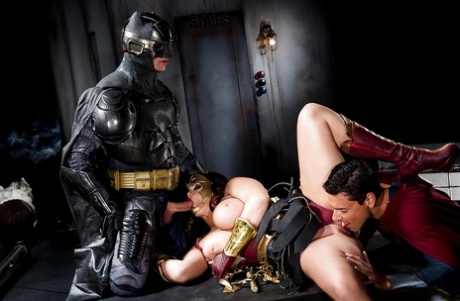 Buxom pornstar Alison Tyler giving Batman and Superman blowjobs
