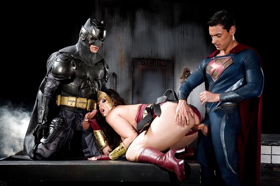 Buxom pornstar Alison Tyler giving Batman and Superman blowjobs