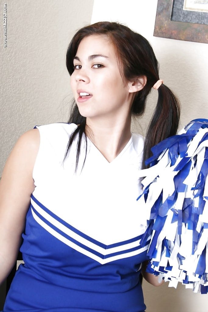 Pigtailed Asian cheerleader Mai Ly flashing pretty upskirt underwear
