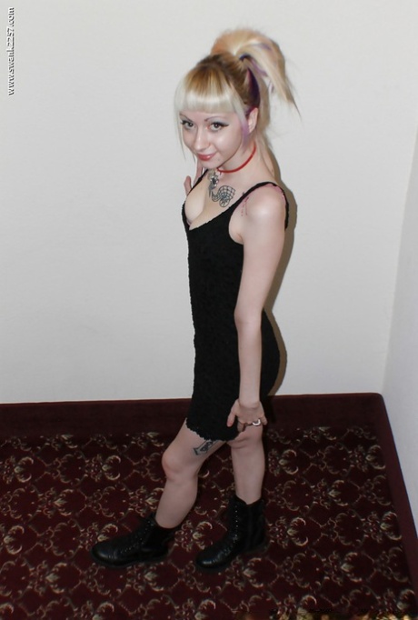 Alternative babe Symone posing for non nude pics in boots and black dress