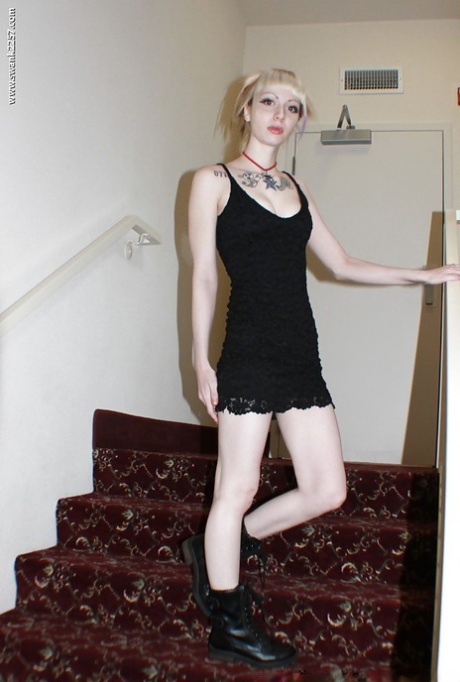 Alternative babe Symone posing for non nude pics in boots and black dress