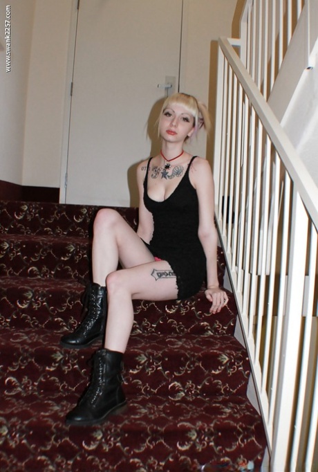 Alternative babe Symone posing for non nude pics in boots and black dress