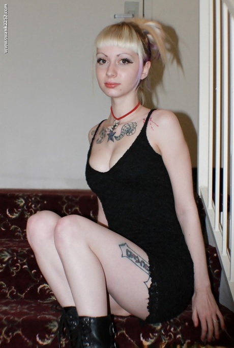 Alternative babe Symone posing for non nude pics in boots and black dress