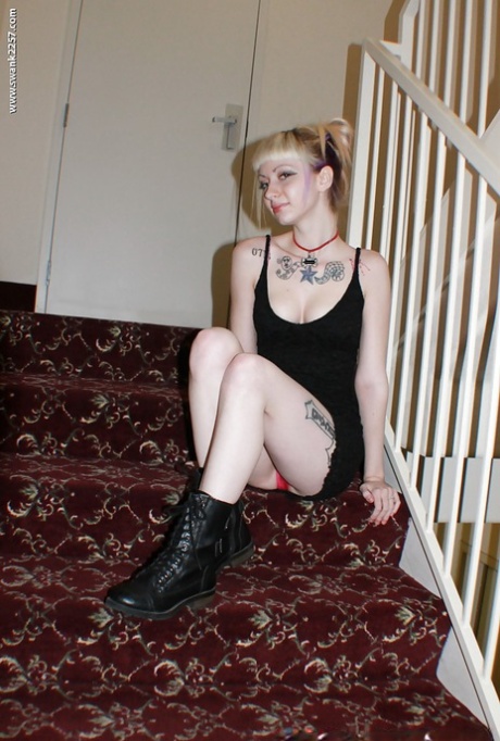 Alternative babe Symone posing for non nude pics in boots and black dress