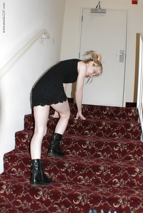 Alternative babe Symone posing for non nude pics in boots and black dress